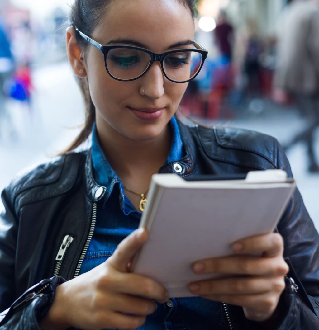 Female user holding electronic device